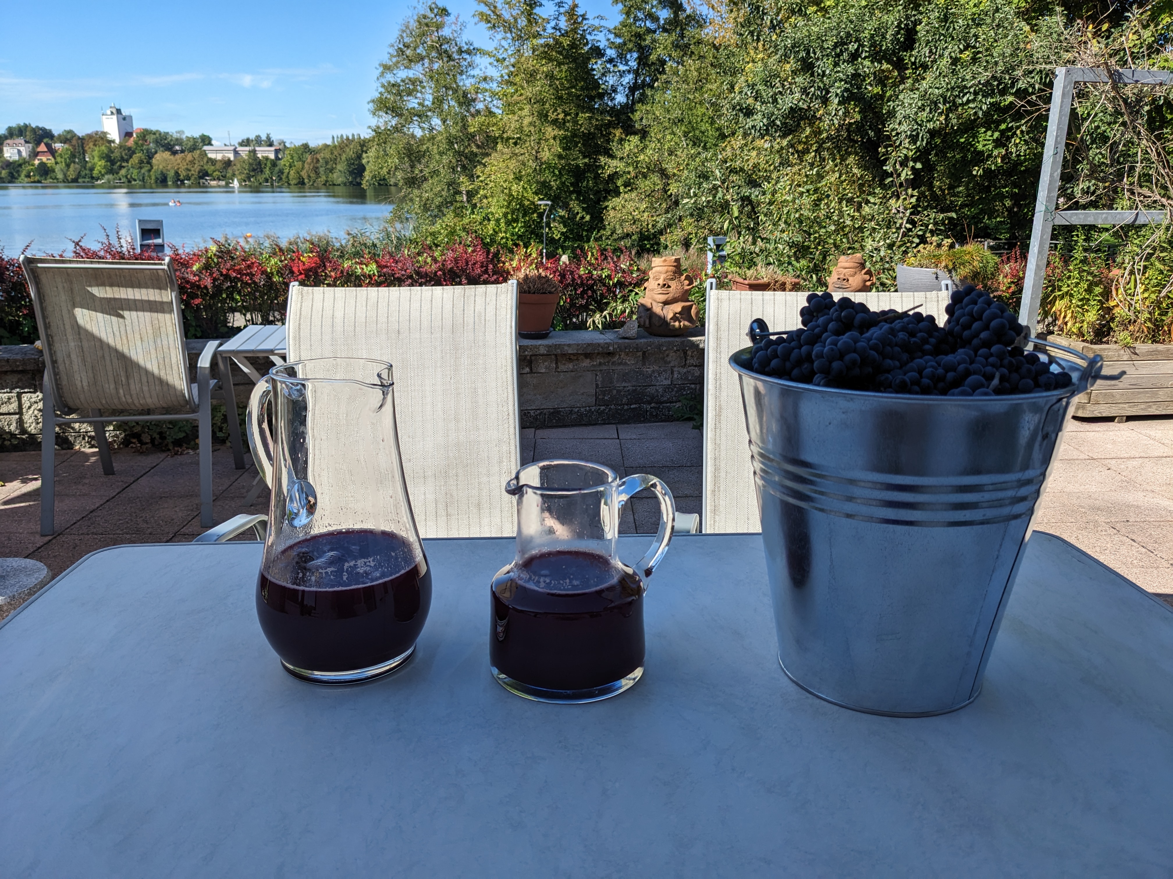 The same jugs, but beside them is the other bucket of grapes&hellip;